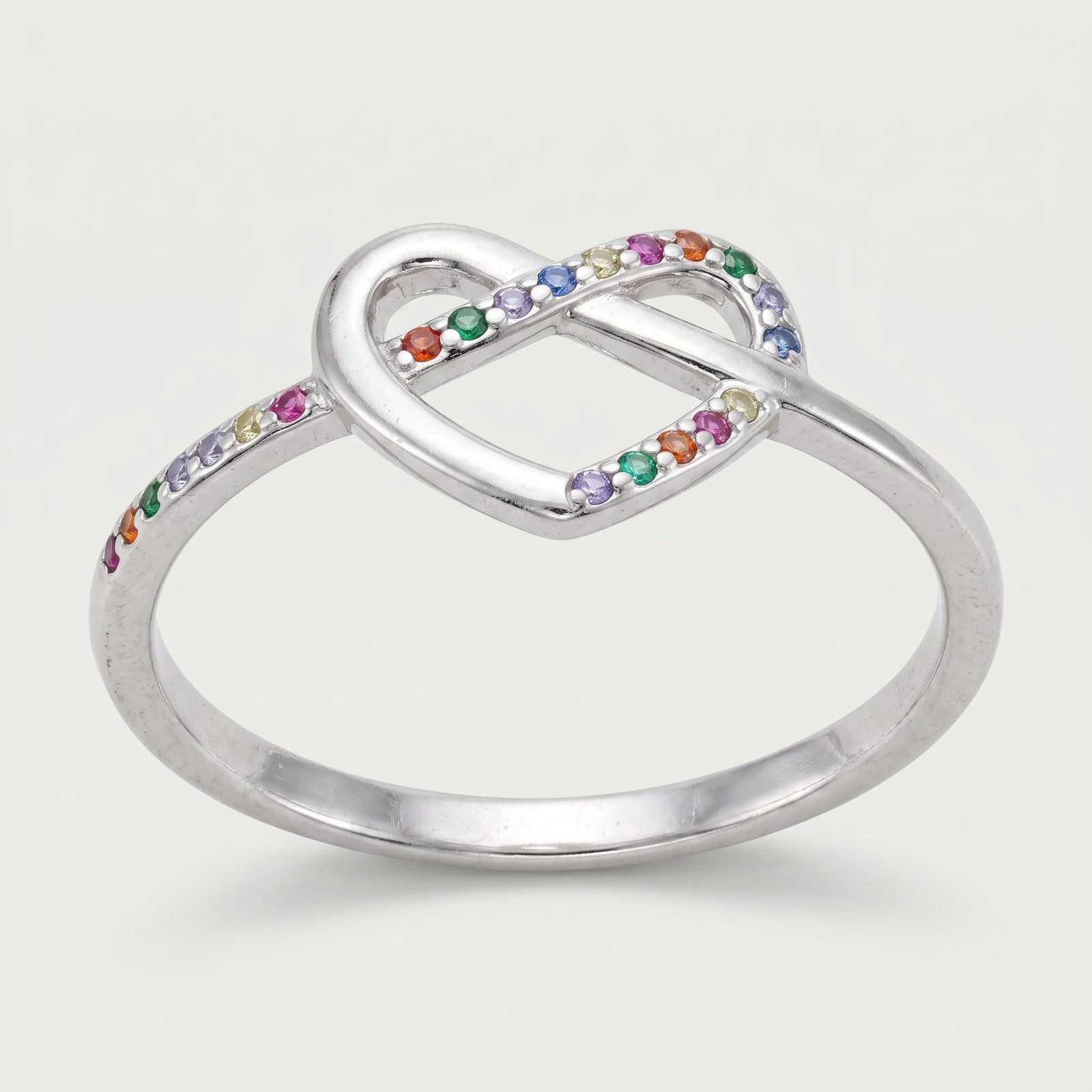 Anillo Corazón Infinito Circones Multicolor Plata - vista principal sobre fondo mineral claro